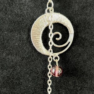Silver swirl & violet glass bead necklace with matching drop earrings
