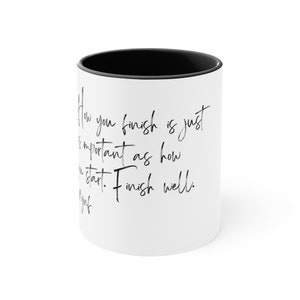 May include: White ceramic coffee mug with a black rim. The mug features black text that reads "How you finish is just as important as how you start. Finish well."