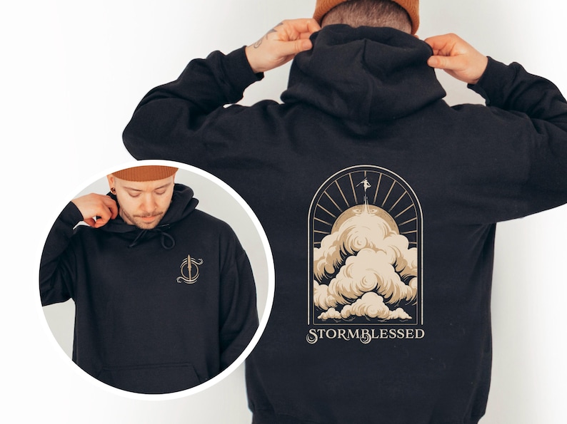 May include: Black hoodie with a graphic of a person flying above clouds with the text "STORMBLESSED" on the back. The front of the hoodie has a small graphic of a stylized letter "S" with a cloud and a lightning bolt.