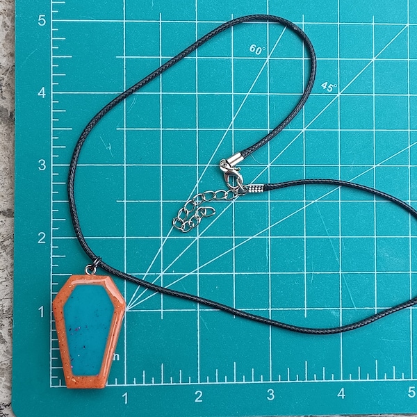 coffin necklace casket necklace pendant Glow In The Dark charm UV active teal & orange sparkles 1" x 1.5" charm 18" resin Halloween necklace