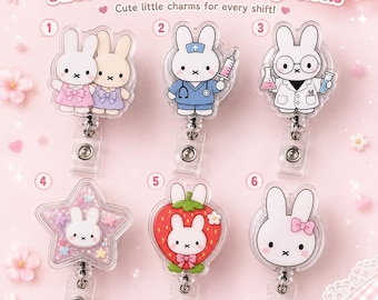 May include: Six badge reels featuring white bunny characters. Designs include two bunnies, a nurse with a syringe, a scientist with beakers, a star-shaped shaker, a strawberry-themed bunny, and a bunny with a pink bow. Text reads Sweet Kawaii Bunny Badge Reels.