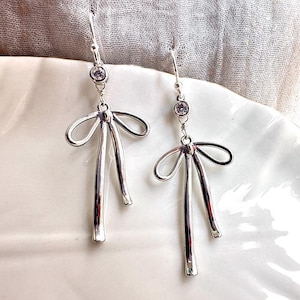 Dainty Silver Ribbon Bow Earrings, Silver dangling bow charm earrings, Drop dangle Earrings, Ribbon Earrings gold, Birthday gift for her