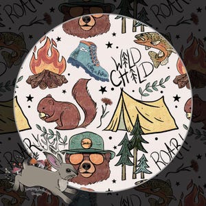 May include: Circular design with camping-themed illustrations. Features a campfire, squirrel, tent, bear wearing a Smokey hat, hiking boot, fish, and the words "Wild Child" and "Take a hike". The design is in shades of brown, green, and orange.