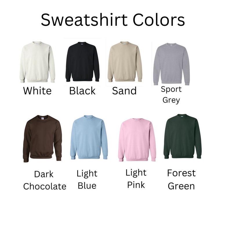 May include: Image displaying eight crewneck sweatshirts in various colors: white, black, sand, sport grey, dark chocolate, light blue, light pink, and forest green. Each sweatshirt is labeled with its respective color name.