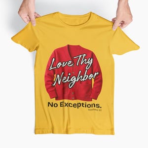 Puede incluir: Camiseta amarilla mostaza con un diseño de cárdigan rojo y las palabras "Love Thy Neighbor" en escritura blanca. Debajo del diseño, el texto dice "No Exceptions." y "Matthew 22."