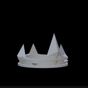 May include: A silver crown with a pointed, jagged design. The crown has a circular base and five points.