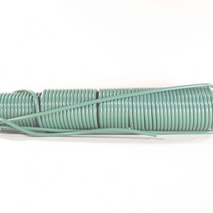 May include: A coiled length of green electrical wire with copper ends.