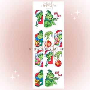 May include: A set of eight Grinch-themed nail decals featuring the Grinch in various poses, including holding a gift, a Christmas bauble, and a sign that says "No". The decals also include the words "Blah Blah" and a red and green Christmas bauble.