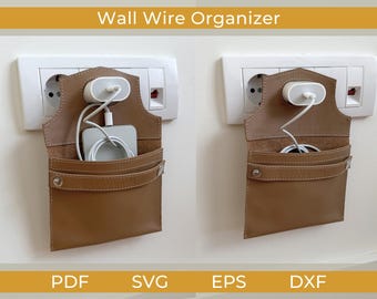 May include: A brown leather wall wire organizer with a white charger and phone inside. The organizer is mounted on a white wall near an electrical outlet. The text "Wall Wire Organizer" is at the top.
