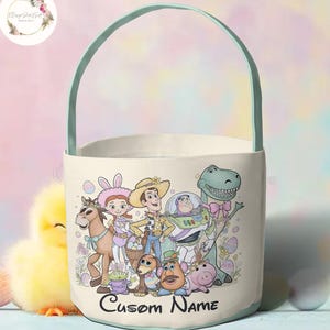 May include: A white Easter basket with a light green handle and trim, featuring a cartoon image of characters from Toy Story. The words "Custom Name" are printed on the front.