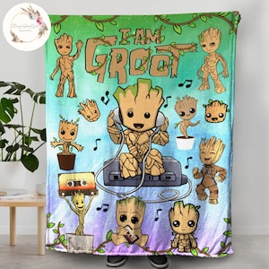 May include: A colorful fleece blanket featuring multiple cartoon images of Groot from Guardians of the Galaxy. The blanket has a blue, green, and purple background with musical notes and vines. The text "I AM GROOT" is printed in the center of the blanket.