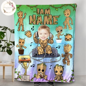 May include: A colorful fleece blanket with a cartoon character design. The blanket features a character with a child's face and the text "I AM NAME".