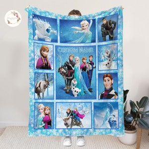May include: A blue fleece blanket with a patchwork design featuring characters from the movie Frozen. The blanket has a snowflake pattern and includes images of Elsa, Anna, Kristoff, Olaf, Sven, and the snow monster. The text "CUSTOM NAME" is printed in the center of the blanket.