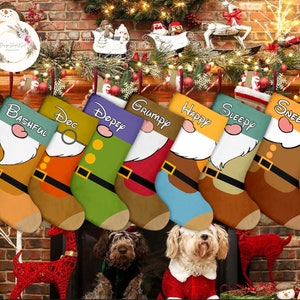 May include: Seven colorful Christmas stockings with the names of the seven dwarfs: Bashful, Doc, Dopey, Grumpy, Happy, Sleepy, and Sneezy. The stockings are hanging on a brick fireplace mantel with a Christmas tree and garland.
