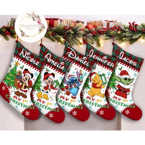 May include: Five personalized Christmas stockings with red and green plaid trim. Each stocking features a different Disney character: Mickey Mouse, Stitch, Winnie the Pooh, and Yoda. The stockings are decorated with a Christmas tree, candy canes, and the text "My 1st Christmas".
