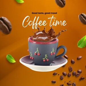 May include: A black and red ceramic coffee cup with a cherry design, filled with dark brown coffee splashing out of the cup. The text "Good taste, good mood Coffee time" is above the cup.