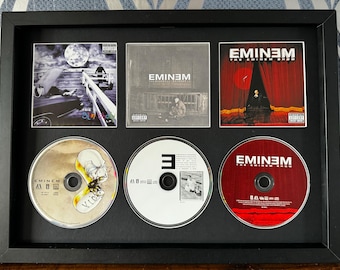 Eminem | The Slim Shady LP | The Marshall Mathers LP | Eminem Show | Triple CD Wall Display | Frame Not Included |