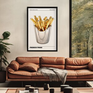 May include: A black and white poster with a gold metallic design of french fries in a silver cup. The poster has the text "Metallic Reality Series" and "Gallery Edition" at the top and "French Fries" at the bottom.