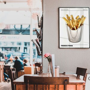May include: A black and white poster with a gold metallic illustration of french fries in a silver cup. The poster has the text "Metallic Reality Series" and "Gallery Edition" at the top and "French Fries" at the bottom.