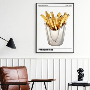 May include: A black and white poster with the text "Metallic Reality Series" and "Gallery Edition" at the top. The poster features a silver container filled with golden french fries. The text "FRENCH FRIES" is at the bottom of the poster.