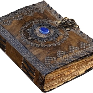 May include: A handcrafted, antique-style journal with a brown leather cover. The cover features intricate embossed patterns, a blue gemstone, and a decorative metal clasp. The pages have a vintage, aged appearance.