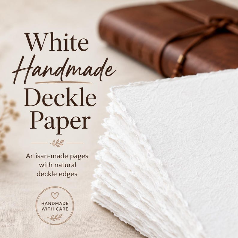 May include: A stack of white handmade deckle paper with natural deckle edges. The paper is artisan-made and has a textured surface. The image also shows a brown leather journal in the background. Text on the image reads "White Handmade Deckle Paper."