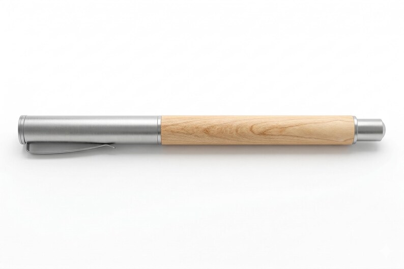 May include: A pen with a light wood barrel and a silver metal cap and tip. The pen has a silver clip and a smooth, natural wood grain finish. The pen is designed for writing.