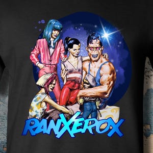May include: A black short-sleeved t-shirt featuring a graphic print of a group of four characters, including a large muscular figure, set against a dark blue circular background. The text RANXEROX is printed in bold blue letters below the characters.