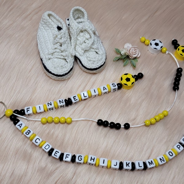 ABC and arithmetic chain with names in black and yellow with soccer ball