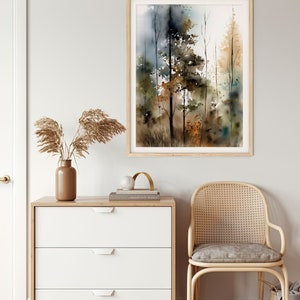 May include: A watercolor painting of a forest scene with tall trees in shades of brown, green, and blue. The painting is framed in a light wood frame and hangs on a white wall.