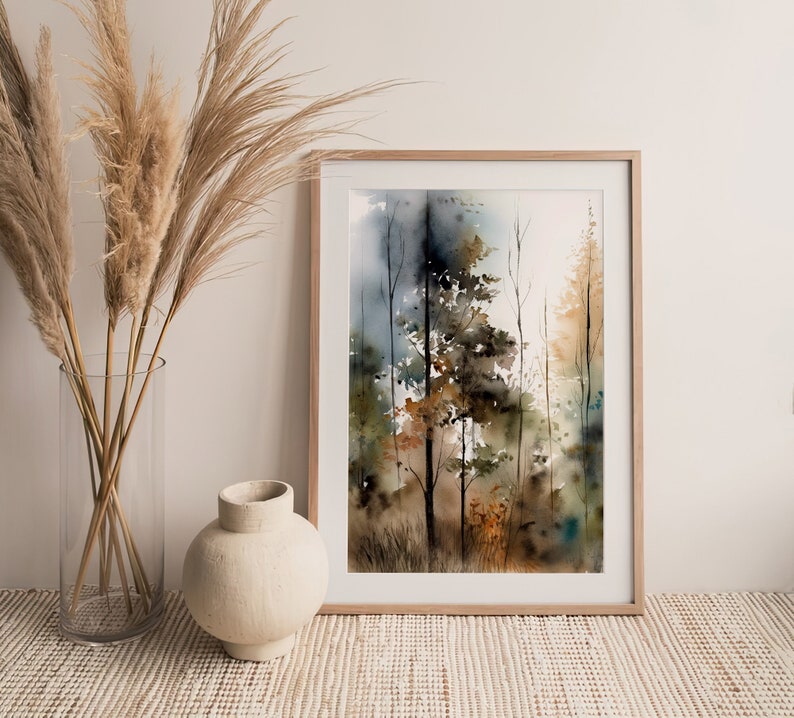 May include: A framed watercolor painting of a forest scene with tall trees in shades of brown, green, and blue. The trees are set against a hazy background, creating a sense of depth and mystery.