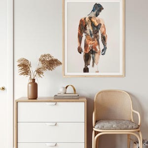 K&ouml;nnte beinhalten: Ein Aquarellbild einer nackten Figur, die mit dem R&uuml;cken zum Betrachter steht. Die Figur ist in Braun-, Orange- und Blaut&ouml;nen gemalt. Das Bild ist in einem hellen Holzrahmen gerahmt.