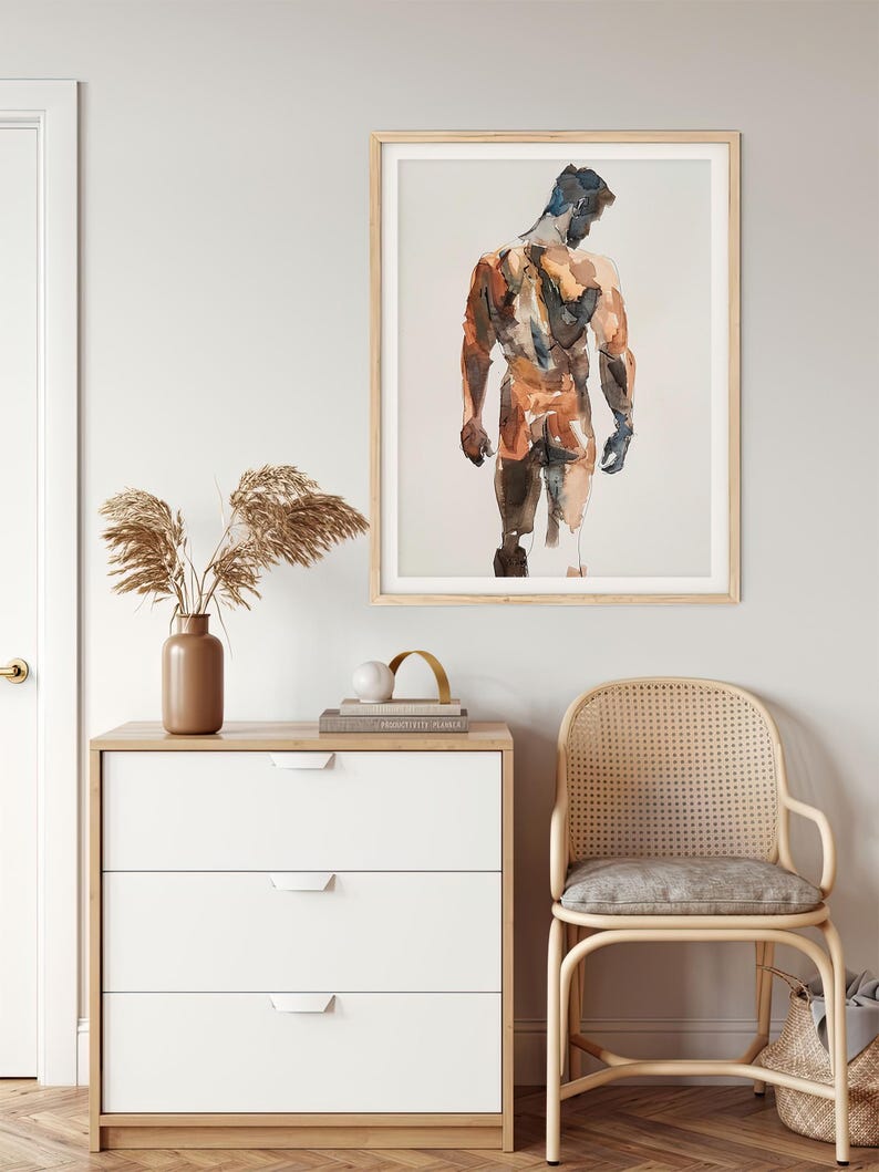 K&ouml;nnte beinhalten: Ein Aquarellbild einer nackten Figur, die mit dem R&uuml;cken zum Betrachter steht. Die Figur ist in Braun-, Orange- und Blaut&ouml;nen gemalt. Das Bild ist in einem hellen Holzrahmen gerahmt.