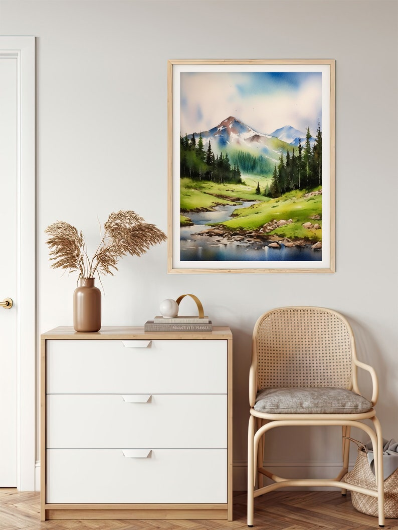 May include: A watercolour painting of a mountain landscape with a river flowing through it. The mountains are green and blue, and the river is a light blue. The sky is a light blue with white clouds.