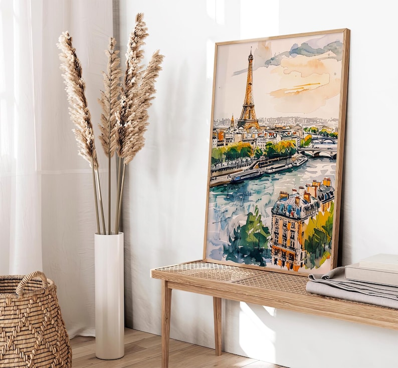 Puede incluir: Una pintura de acuarela de la Torre Eiffel en Par&iacute;s, Francia. La pintura muestra la torre desde la distancia, con el r&iacute;o Sena en primer plano y edificios en el fondo. La pintura est&aacute; realizada en un estilo ligero y aireado, con colores suaves y pinceladas.