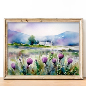 May include: Watercolor painting of a white cottage in a field of purple wildflowers with a mountain range in the background.