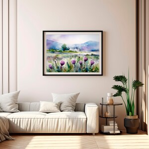 May include: A watercolor painting of a white house in a field with purple flowers in the foreground and mountains in the background.