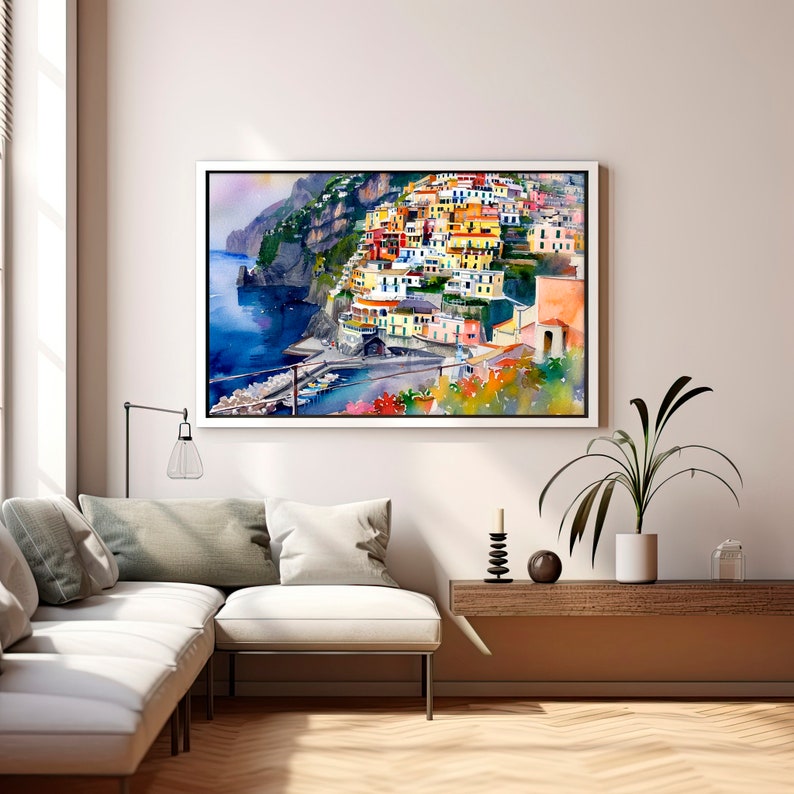 May include: A watercolour painting of a colourful Italian village built on a cliffside overlooking the ocean. The buildings are painted in shades of yellow, orange, red, and blue. The water is a deep blue, and the sky is a light blue.