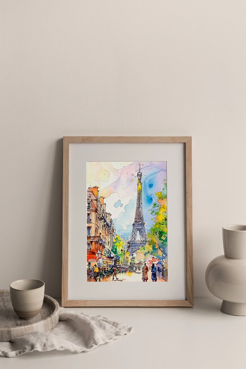 Puede incluir: Una pintura de acuarela de la Torre Eiffel en Par&iacute;s, Francia. La pintura muestra una escena de calle con gente caminando y un caf&eacute; en primer plano. La Torre Eiffel est&aacute; en el fondo, con un cielo azul y nubes arriba.