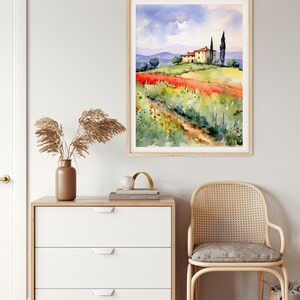 May include: Watercolor painting of a house on a hill with a field of red flowers in the foreground. The house has a red roof and is surrounded by green trees. The sky is blue with white clouds.