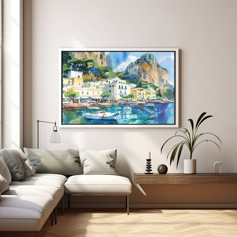 May include: Watercolour painting of a coastal town with colourful buildings, a white boat in the water, and a mountain in the background.