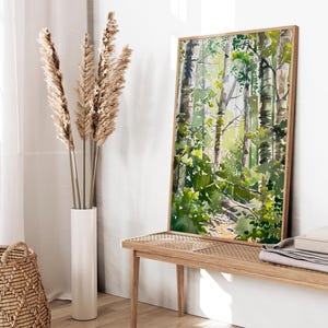 May include: A framed watercolor painting of a forest scene with green trees and a path leading through the woods.