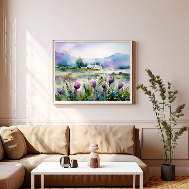 May include: A watercolor painting of a white cottage in a field of purple wildflowers with a mountain range in the background.