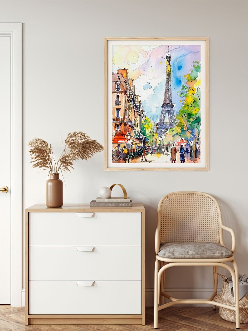 Puede incluir: Una pintura de acuarela de la Torre Eiffel en Par&iacute;s, Francia. La pintura muestra la torre en la distancia con edificios y &aacute;rboles en primer plano. La gente camina por la calle.