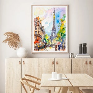 Puede incluir: Una pintura de acuarela de la Torre Eiffel en Par&iacute;s, Francia. La pintura muestra la torre en la distancia con edificios y &aacute;rboles en primer plano. La pintura est&aacute; enmarcada en un marco de madera claro.