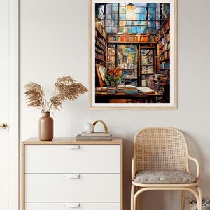May include: A framed watercolour painting depicting the interior of a bookshop, featuring a large window, wooden shelves stacked with books, and a table piled high with books. The painting evokes a warm and welcoming atmosphere.
