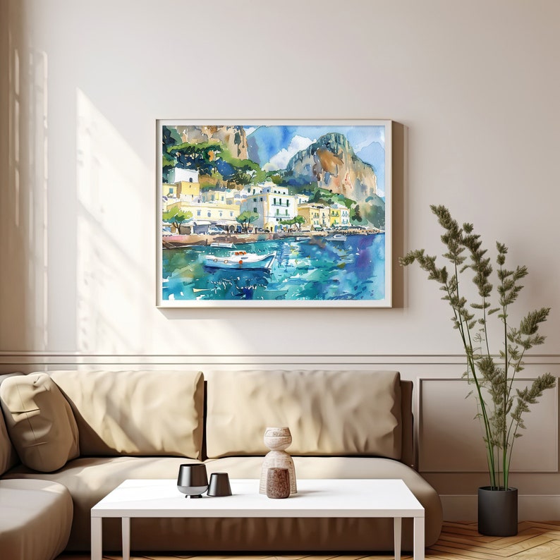 May include: Watercolour painting of a coastal town with white buildings, green trees, and a blue sea. A small white boat is in the foreground, and the background features rocky cliffs.