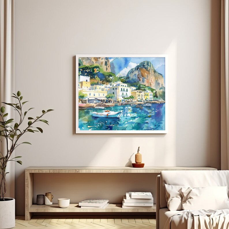 May include: A watercolour painting depicting a coastal town with white buildings, green trees, and a blue sea. A small white boat is in the foreground, and the background features rocky cliffs.