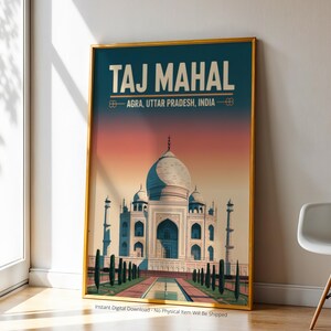 May include: A framed print of the Taj Mahal in Agra, India. The artwork features the iconic white marble mausoleum against a gradient sky of orange and blue. The text "TAJ MAHAL" is at the top, with the location below.