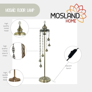 May include: A gold mosaic floor lamp with a decorative metal head, a twisted metal pipe, and a round base. The lamp has a chain with multiple bells hanging from it. The lamp has an on/off switch on the cord.